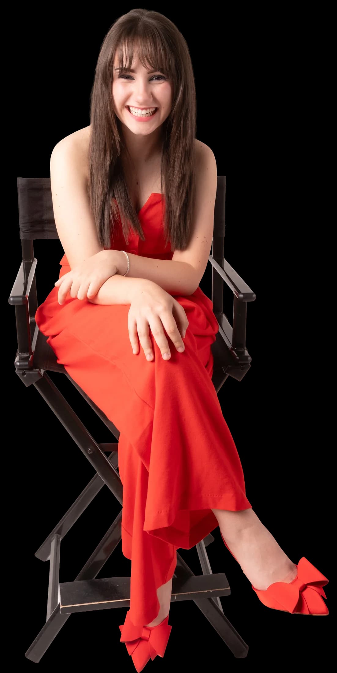 Ema Dujmović in a red dress on a director's chair